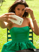 Brunette teen cutie in sexy poses in an azure dress