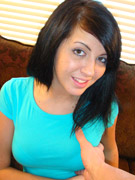 Maiden in blue top showcase her juicy pink pussy on a brown couch.